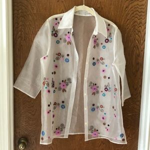 White (see-thru) tunic style blouse.  3/4 Sleeves. Beautiful embroidery flowers